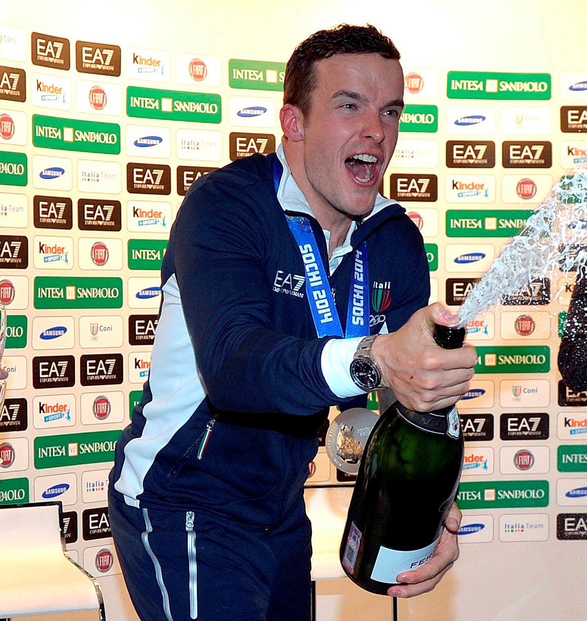 Innerhofer takes silver, Italy's first medal of the Games in Sochi, celebrating with Ferrari